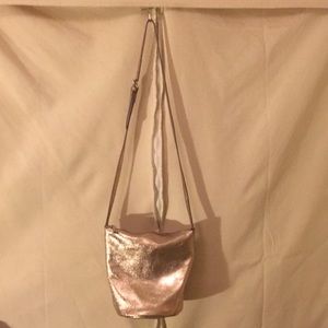 Anthropologie 7CHI rose gold cross body bucket bag